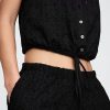 Pantaloni lați cu talie medie cu ochiuri